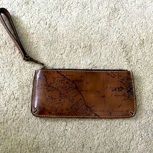 Brown leather map wristlet.